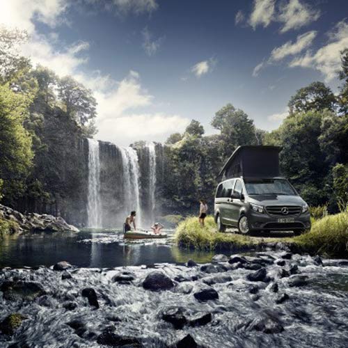 Camper next to Waterfall